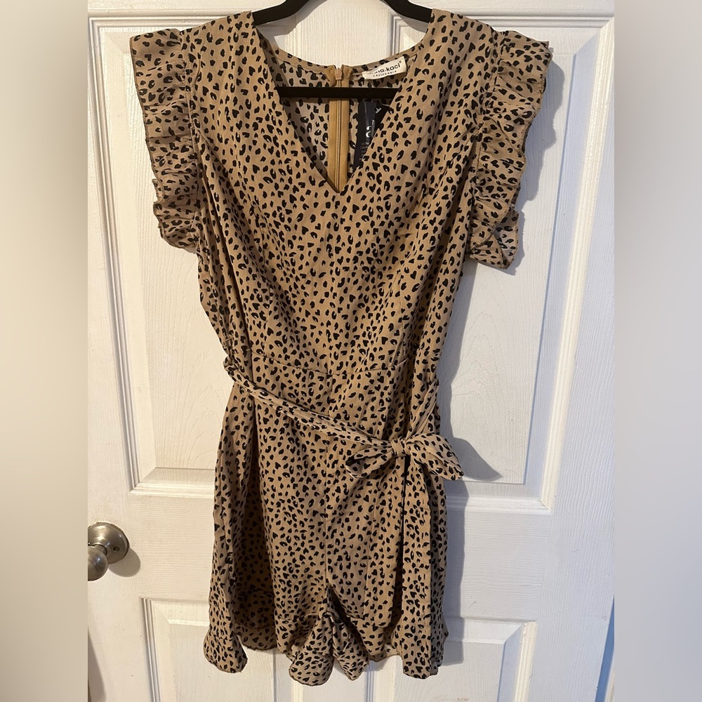 NWT. Leopard print romper. Tag says Large, but runs like a medium.